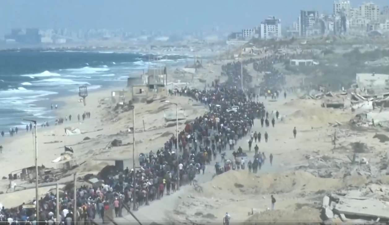 Cena urbana de Gaza representando o bloqueio das passagens de fronteira e a crise humanitária no território.