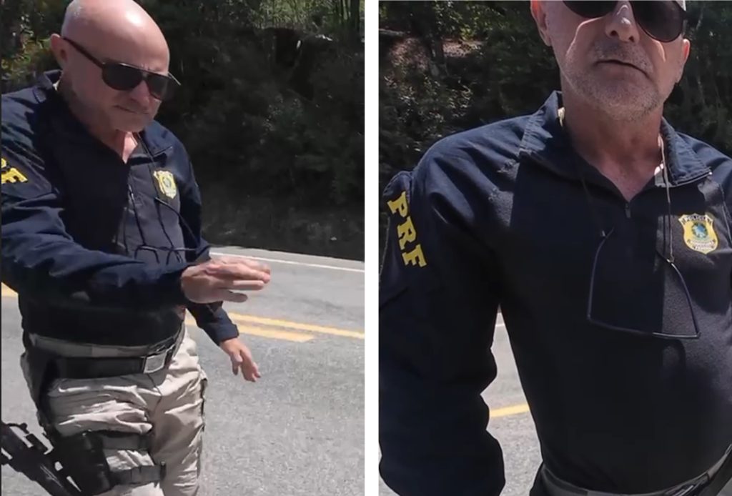 Policial rodoviário federal abordando motociclista estrangeiro em rodovia no estado do Amazonas