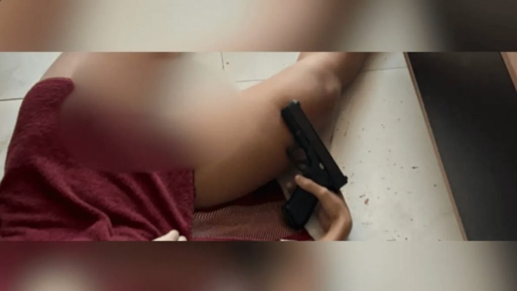 Oficial da PM em imagens de cameras de seguranca apos disparo em apartamento em Sao Paulo