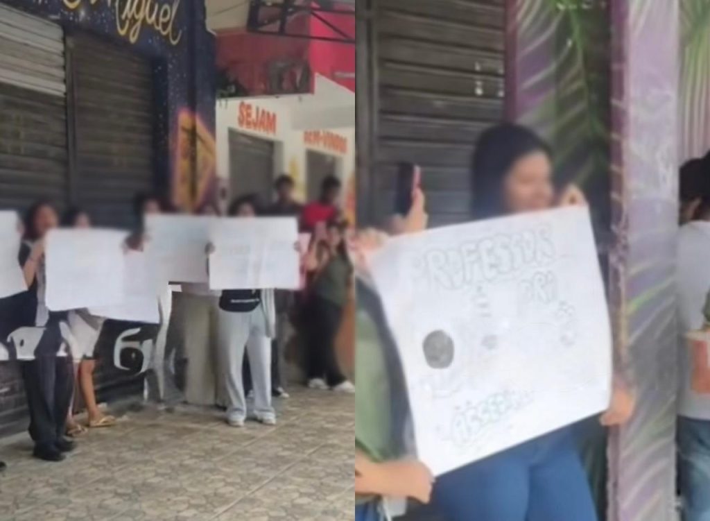 Estudantes da Escola Estadual Vasco Vasquez seguram cartazes durante protesto contra assédio sexual em Manaus.